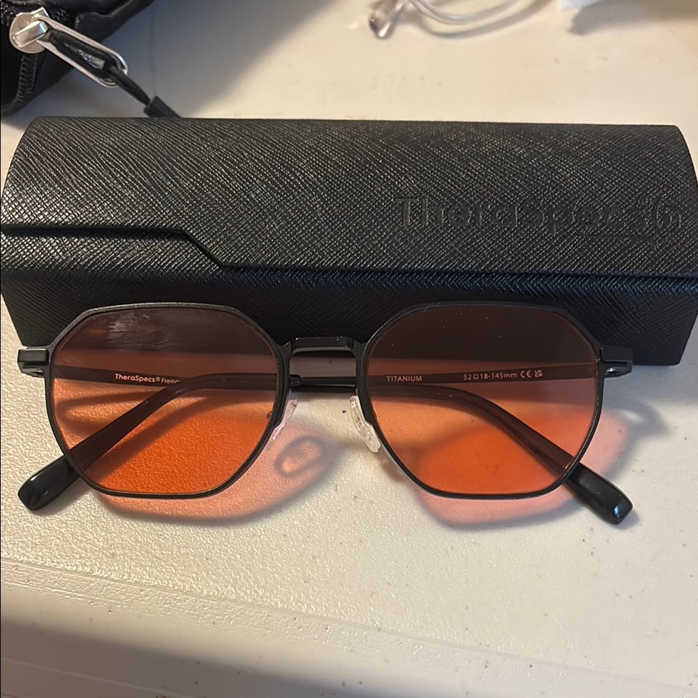 TheraSpecs migraine and concussion Sunglasses with FL-41 pink Lenses